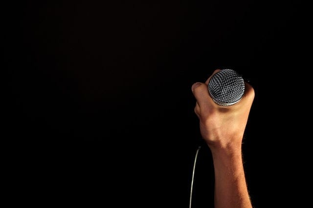 https://images.pexels.com/photos/33779/hand-microphone-mic-hold.jpg?dl&fit=crop&w=640&h=426